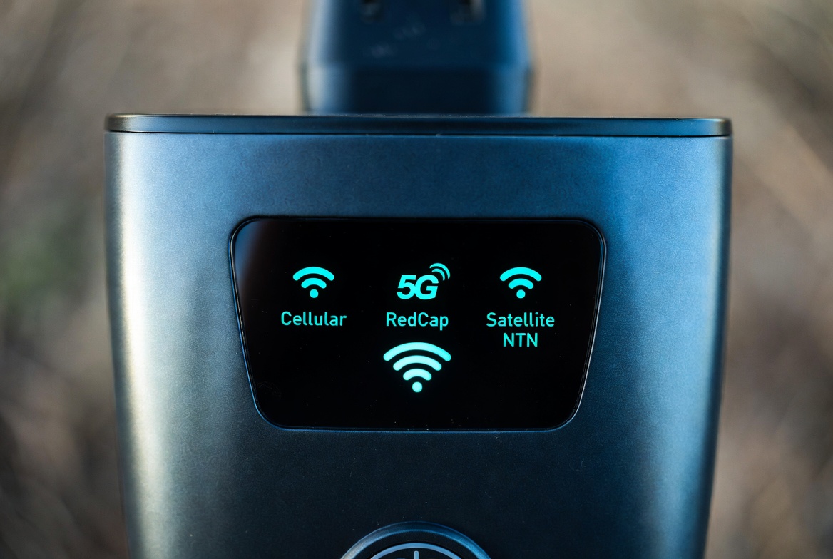 A tracker that autonomously switches between Cellular, 5G RedCap, and Satellite NTN (Non-Terrestrial Network) based on route risk